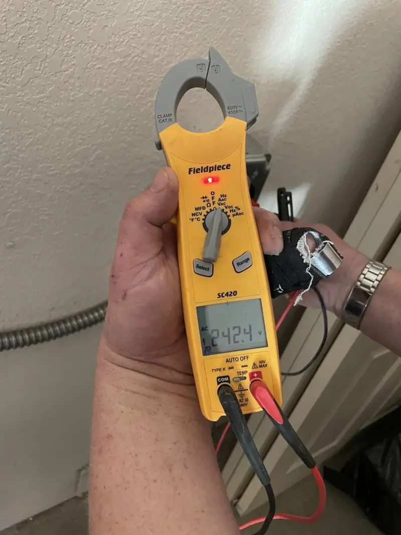 Voltage testing with clamp meter during Generator Installation in St. Francis